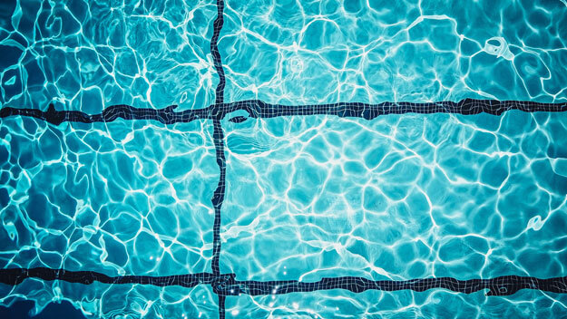 Crystal Clear Pools and the COVID Situation - Pool - Top view of a swimming pool with pool ripples. 