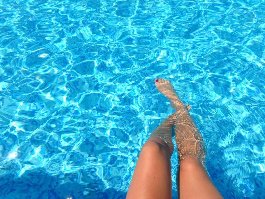 Crystal Clear Pools - Pool Cover Rebates - Pool Water with woman's legs